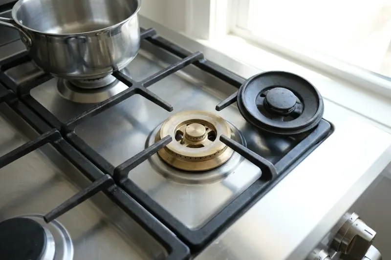 Gas burner with its cap lifted off and no flame